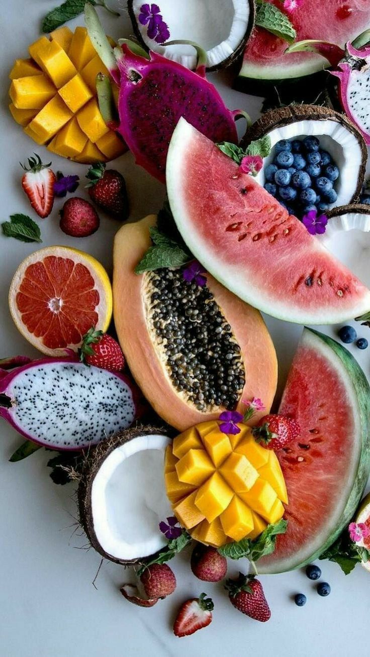 A colorful spread of watermelon, grapes, berries, citrus, and papaya supporting kidney filtration